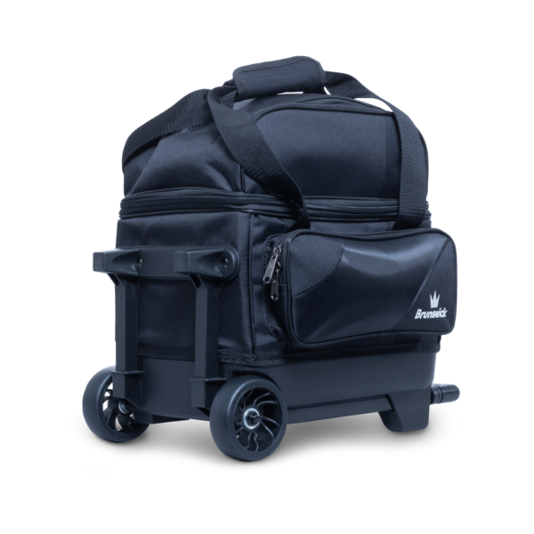 A single ball roller bag all in black laying down three quarter view showing wheels and base.