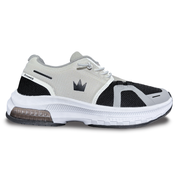 The black and white Alpine right shoe side view with the toe pointing right.