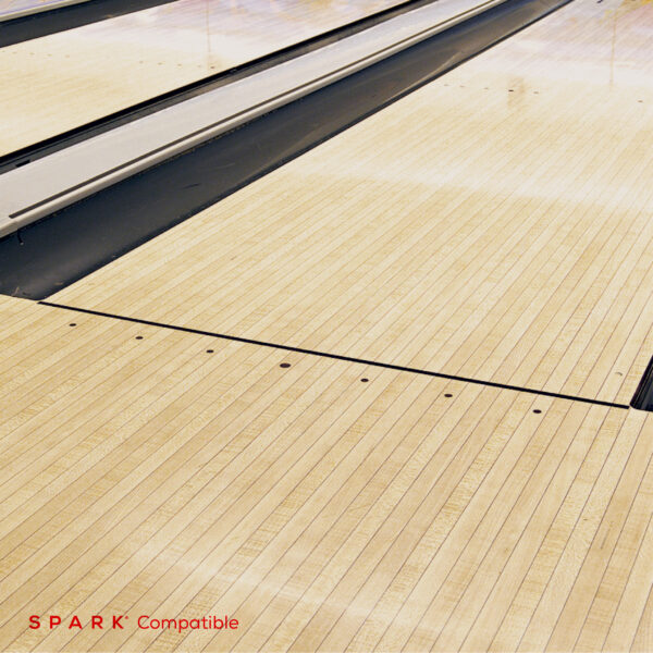 Brunswick Anvilane synthetic bowling lane surface installation with maple appearance - Spark compatible flooring