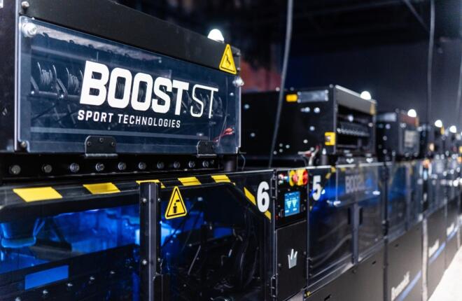 Rear view of Boost ST string pinsetters with caution signs and numbered zones.