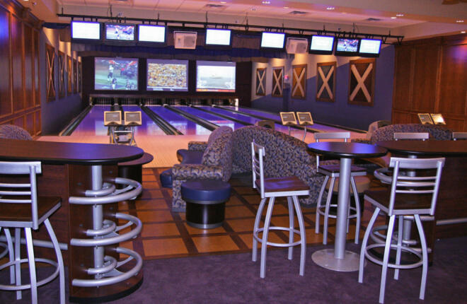 VIP suite with dining tables and lanes in the background