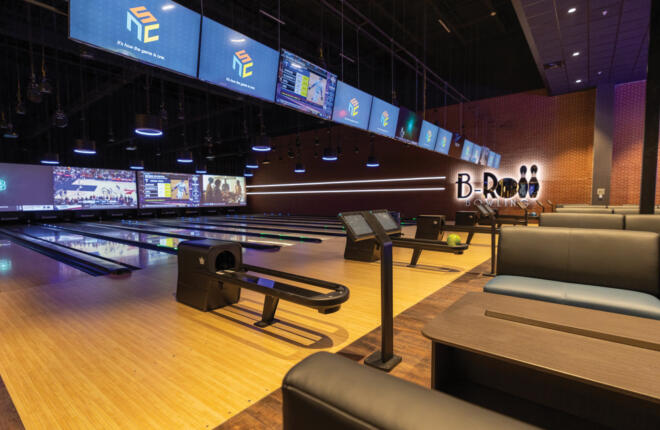 view of brunswick bowling lanes and seating area for bowlers