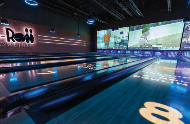 Bowling lanes with Spark projection on lane surface.