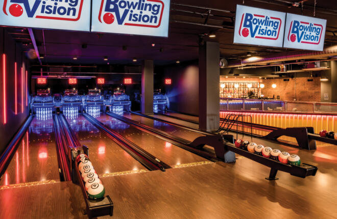 View of the lanes, ball return and balls.