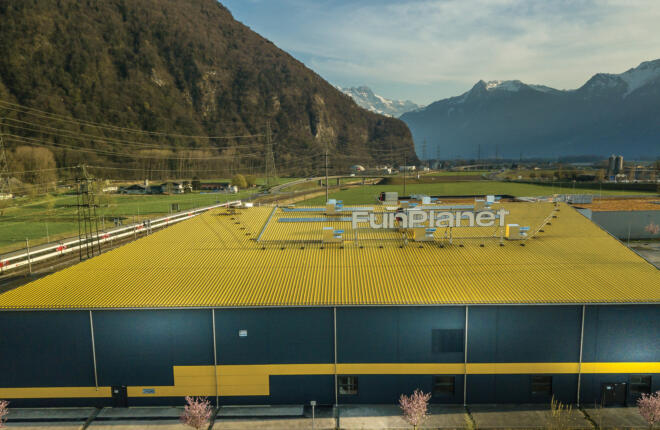 Exterior of Fun Planet set among the mountains