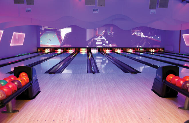 Bowlers area with view of the lanes, video masking units, sync & ball returns