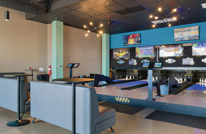 Lounge seating area with Brunswick duckpin bowling lanes and modern decor at Lansing Duckpin Lansing MI