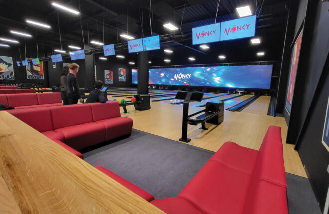 bowlers area seating with bowling lanes