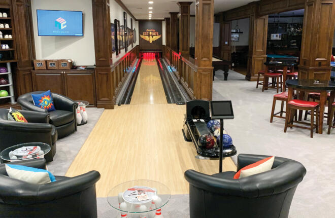 Seating area in view of single lane, Sync scoring tablet and ball return.