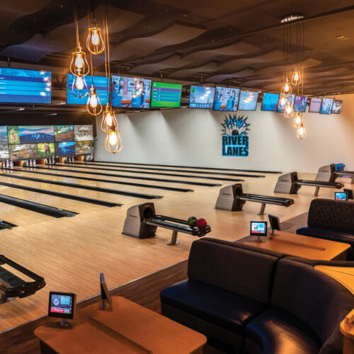 Image of the bowling lanes with Center Stage furniture and Sync Scoring