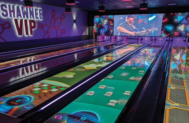 VIP lanes with Spark projection on lanes and large projection tv above pinsetter