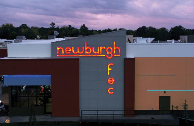 Newburgh FEC lit exterior signage on the building