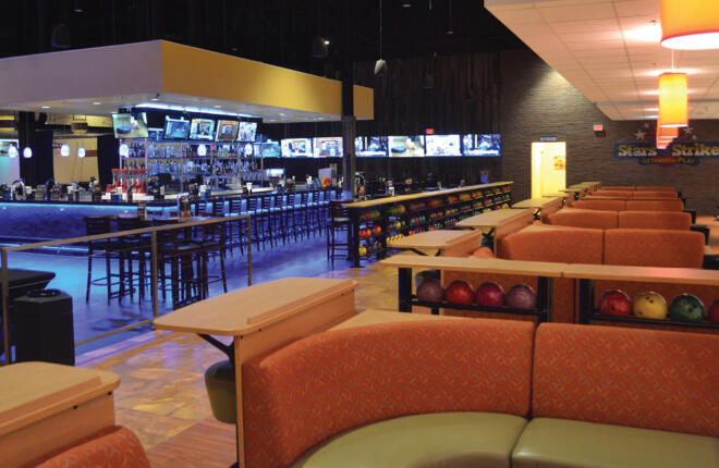 Bar area adjacent to the bowlers area with Center Stage furniture and ball racks