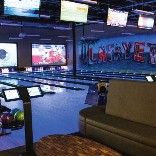 Bowling area, seating, lanes and Sync tablet