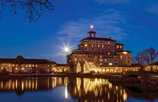 The Broadmoor building and grounds at night