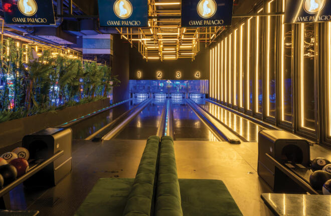 Arcade with pool table, game machines, and "REDEMPTION" sign.