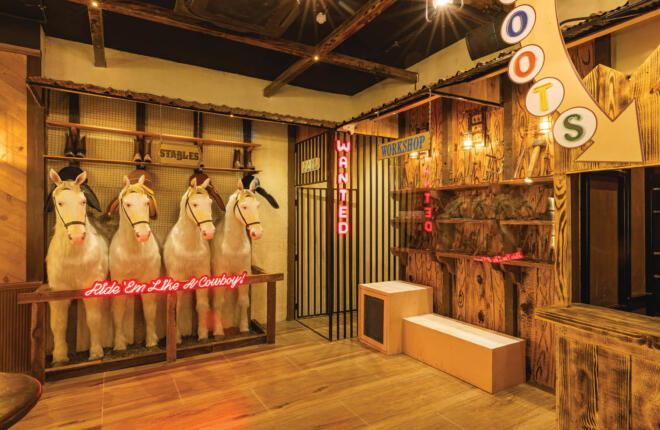 Stable area with horses and a jail cell