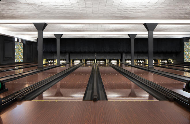Image of the lanes and ball returns. Colorfull lanes in formal mahogany