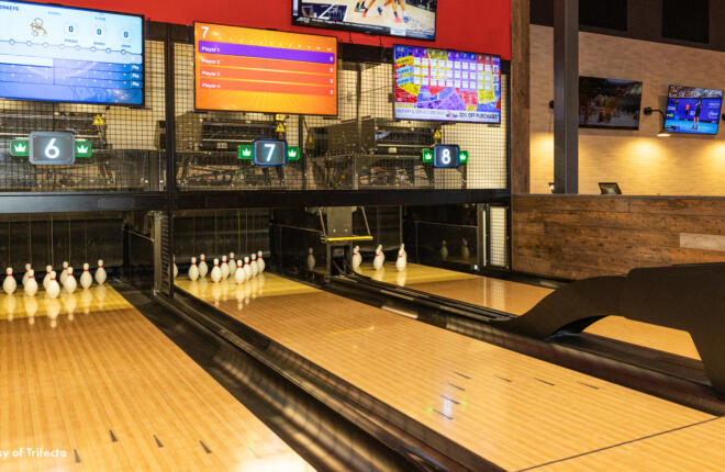 Close-up view of Brunswick bowling lanes with overhead digital displays at WOW entertainment venue St Louis Missouri