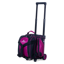 A single ball roller bag in raspberry and black upright three quarter view facing left with handle extended.
