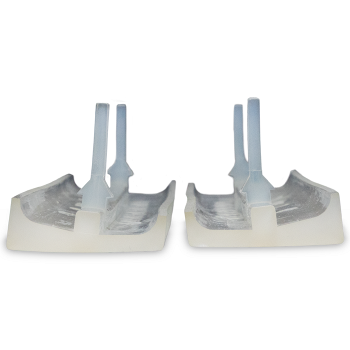 Top-down angled view of TPU scissor dampers showing the long mounting tabs and contoured channel design.