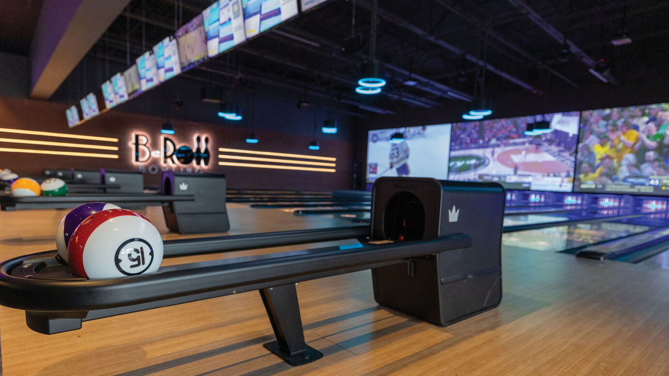 Brunswick ball return close-up with bowling ball setting on it